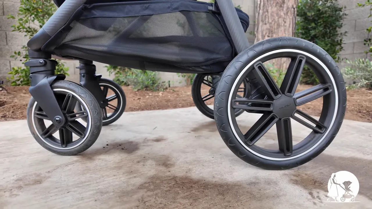 Clear side profile of Nuna PIPA URBN infant car seat installed on Nuna TRIV LX stroller showing canopy and frame