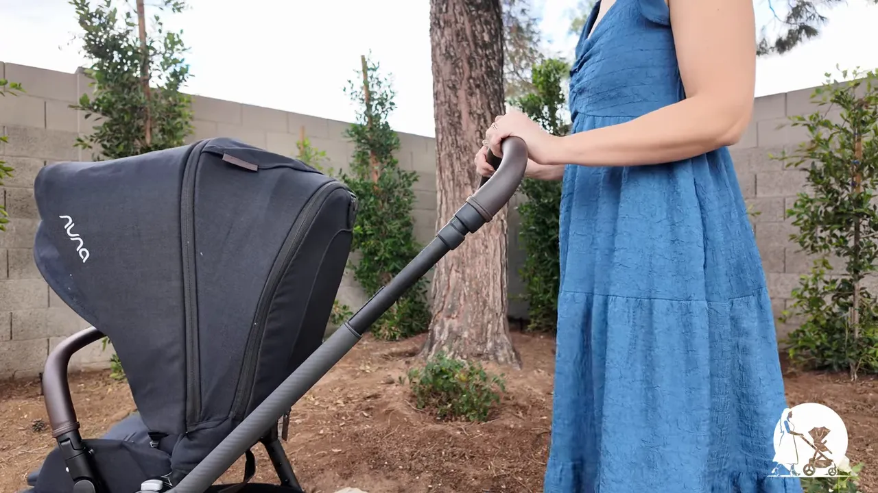 View from parent perspective over the Nuna TRIV LX canopy walking on a sidewalk