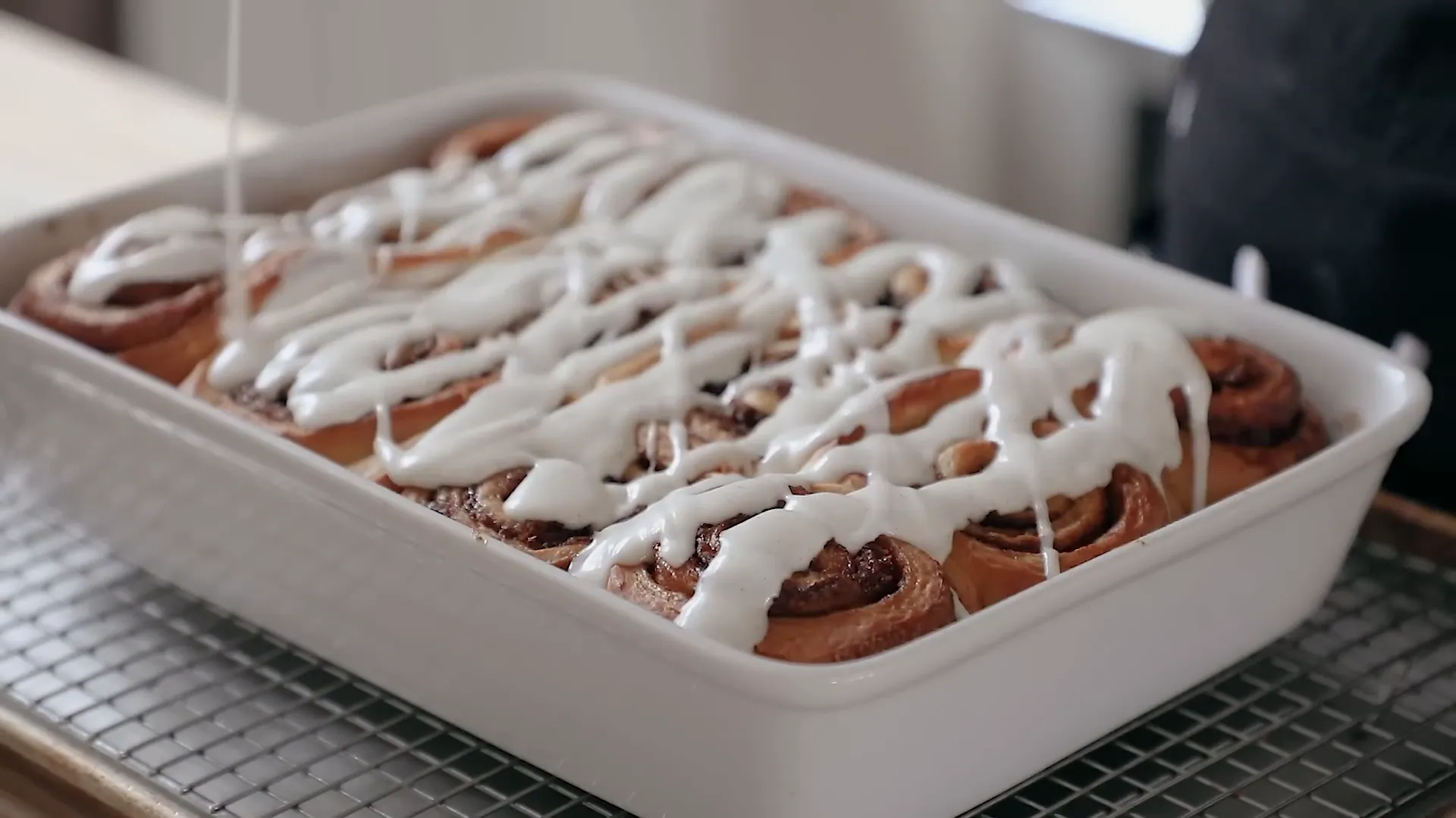 Taking a bite of the cinnamon roll.