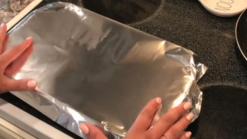Covering the dish with foil before baking