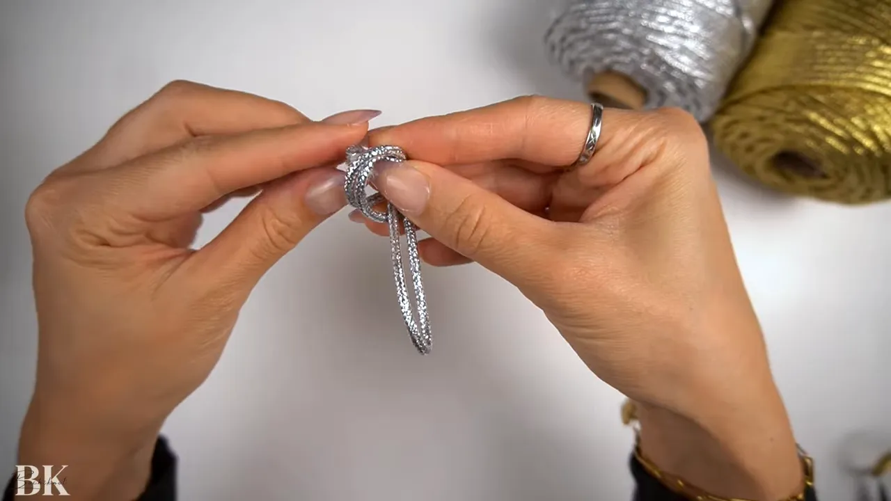 Completed overhand knot forming a looped macrame handle