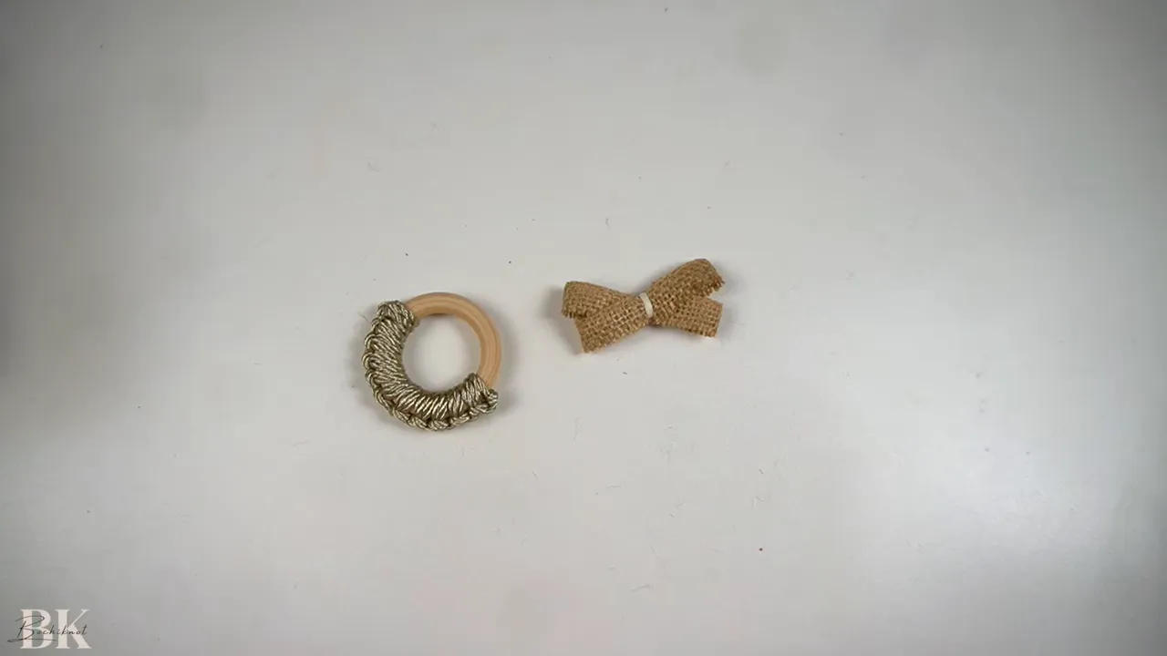 Folding the ribbon into layered loops for the bow