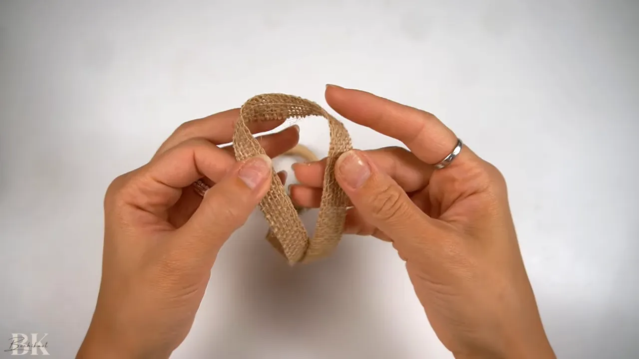 Folding the ribbon into layered loops for the bow