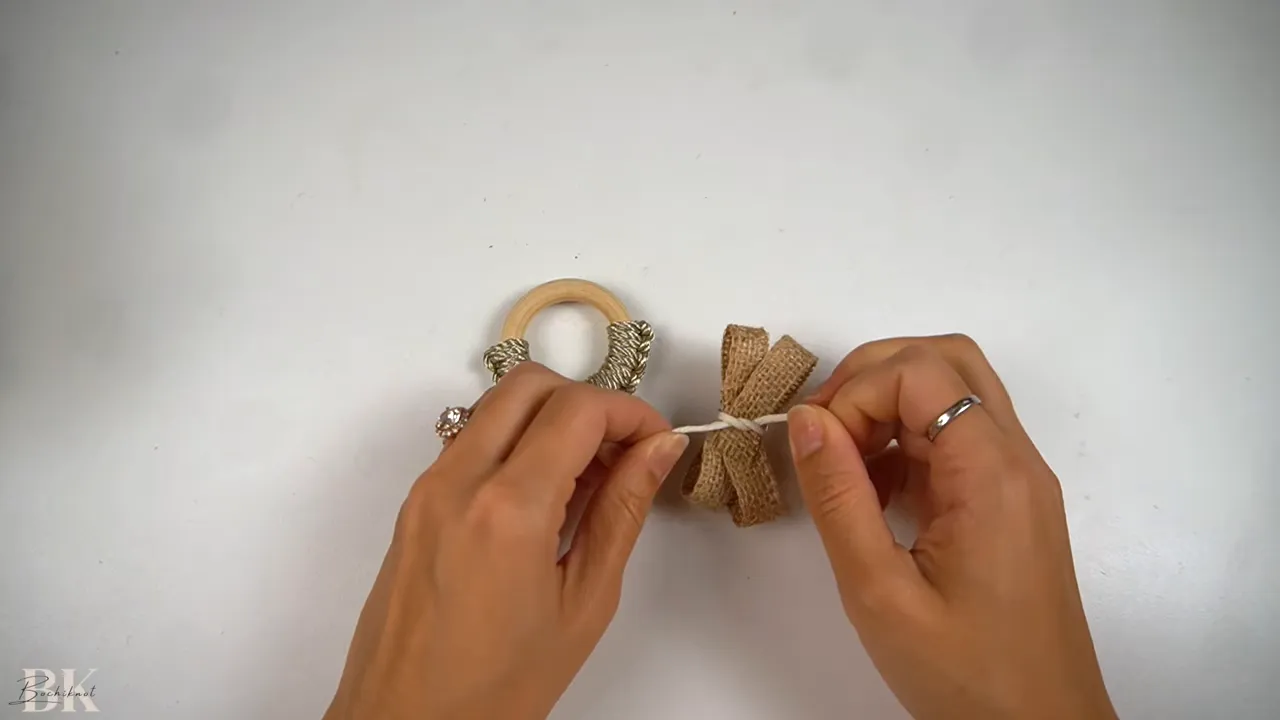 Folding the ribbon into layered loops for the bow