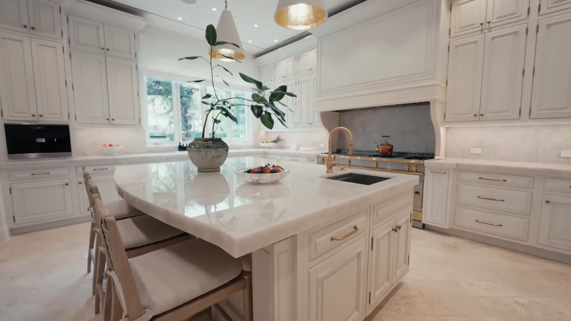 The well-designed kitchen space with white awnings and ample counter space.