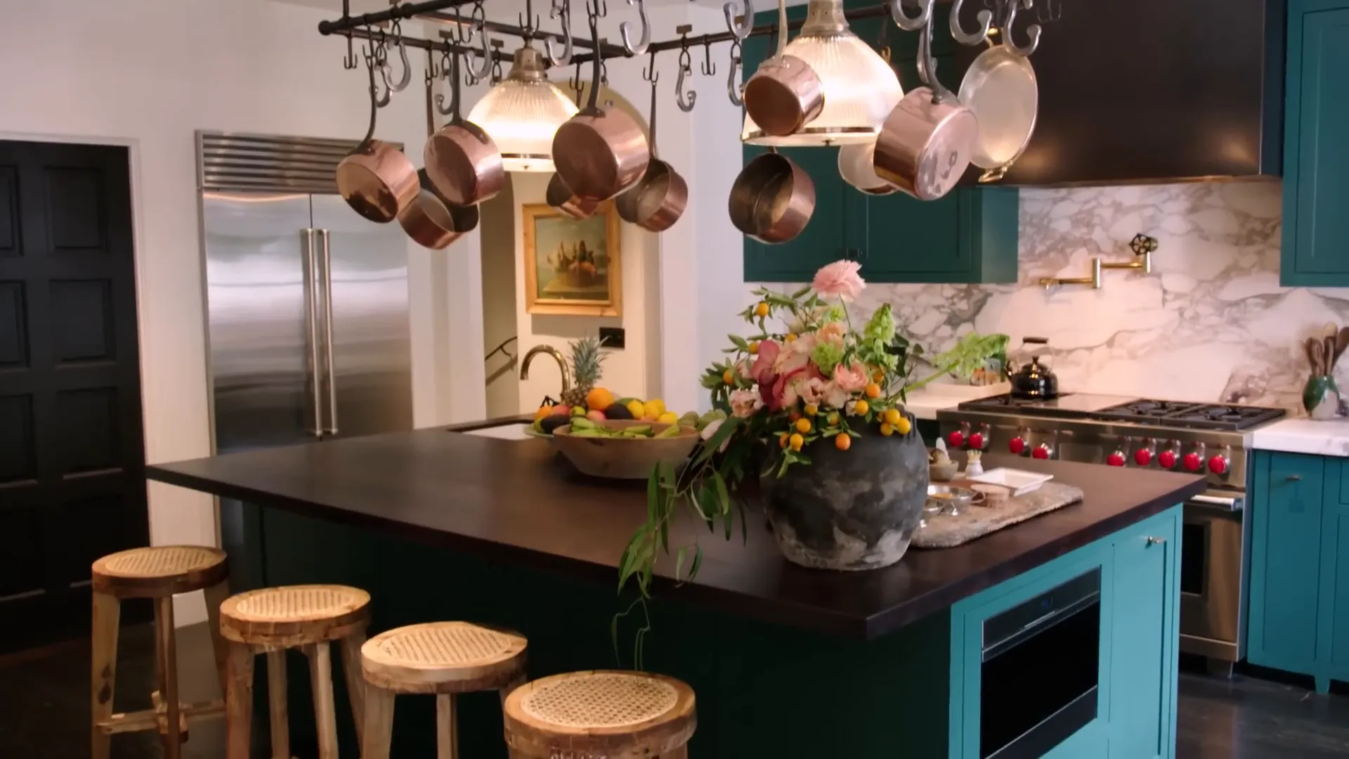 Stylish kitchen with dark green cabinets