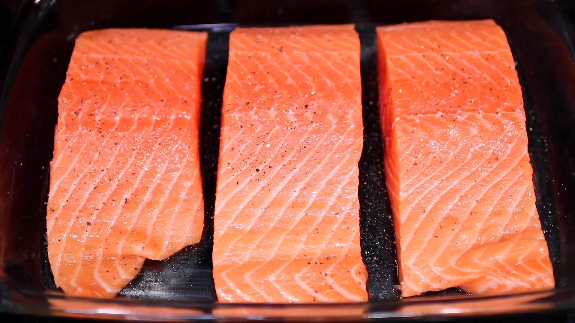 Seasoning the salmon with salt and pepper