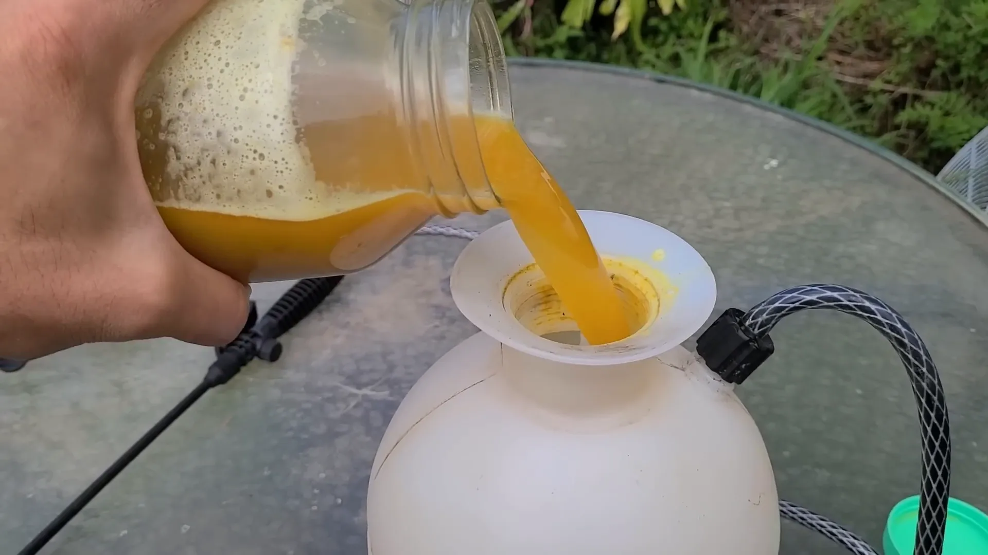 Filtering the bug spray through a nut milk bag