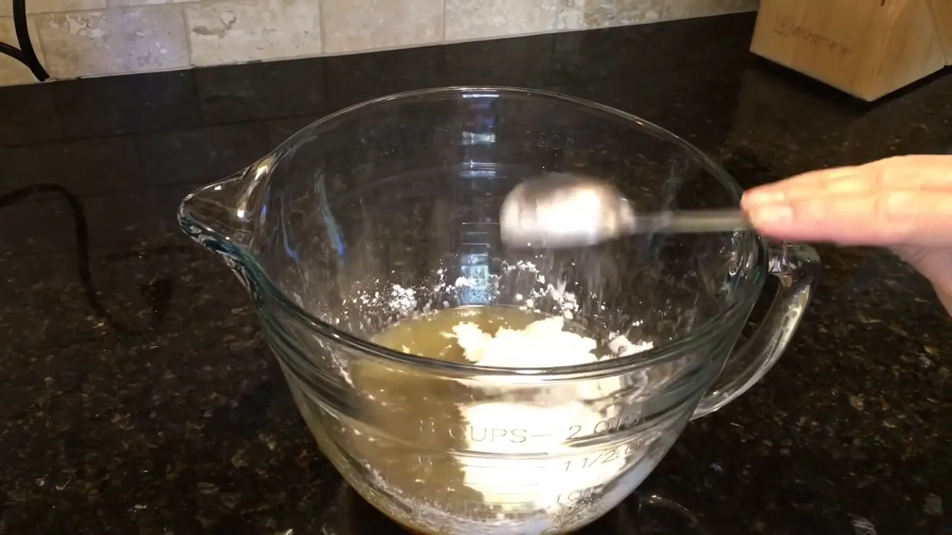 Adding cornstarch to the mixture.