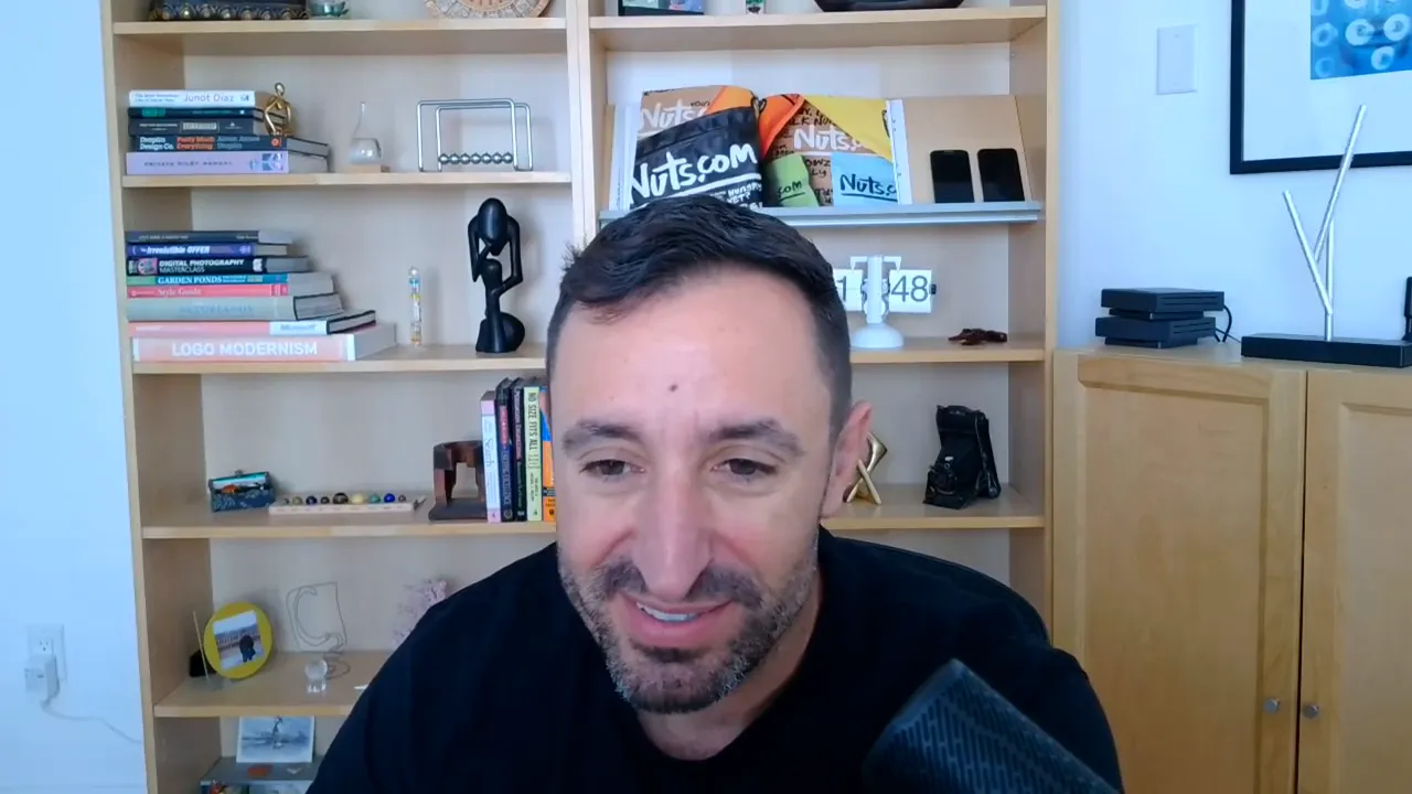 Presenter centered in a home office with bookshelf behind, speaking directly to camera