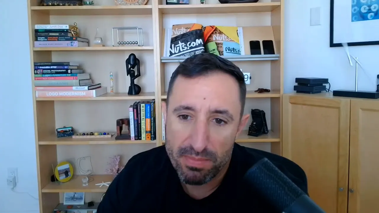 Presenter speaking in a home office with a bookshelf and microphone, explaining marketing funnels.