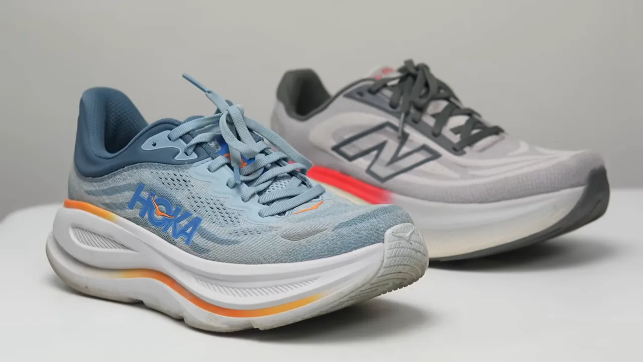 Hoka Bondi 9 held by reviewer, clear side view of blue upper and thick midsole
