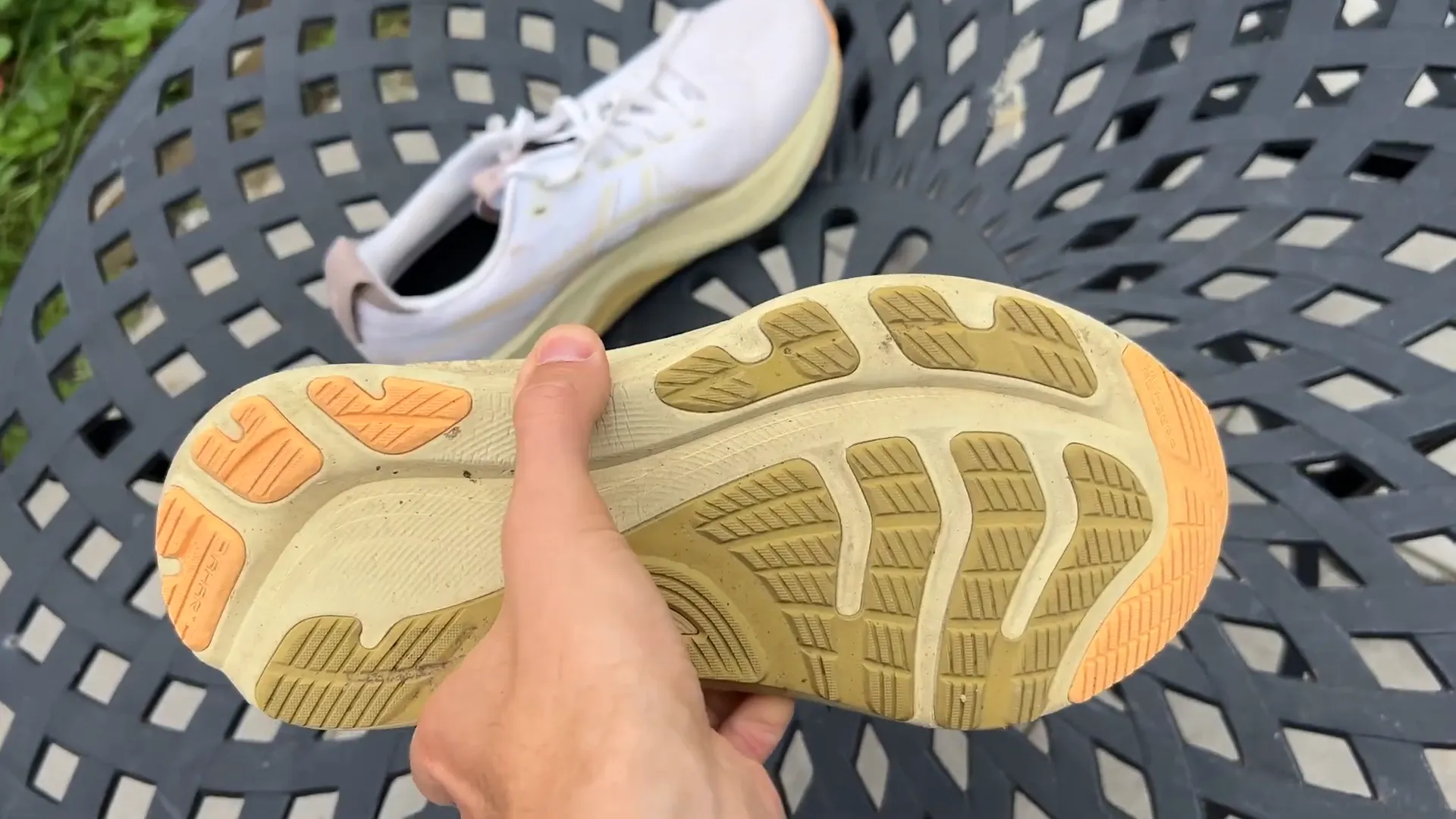 Asics Gel Kayano 32 on pavement showing sturdy outsole