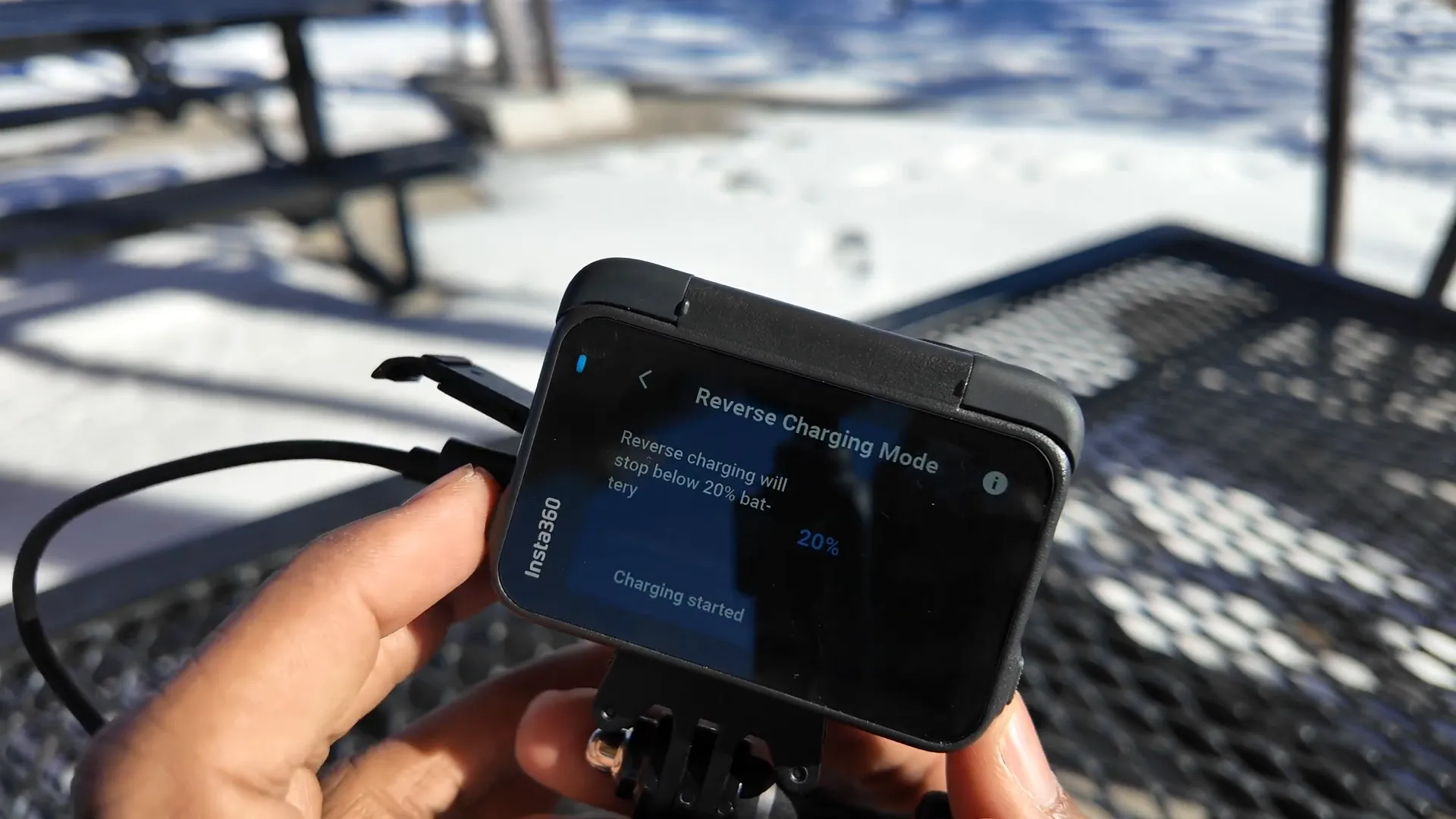 Demonstrating reverse charging with Insta360 Ace Pro 2