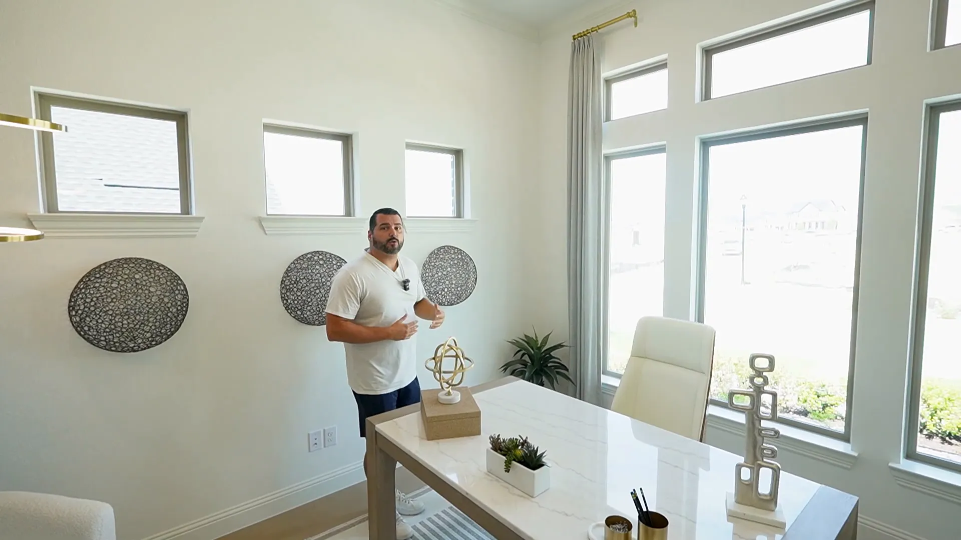 Home office interior with tall windows and crown molding