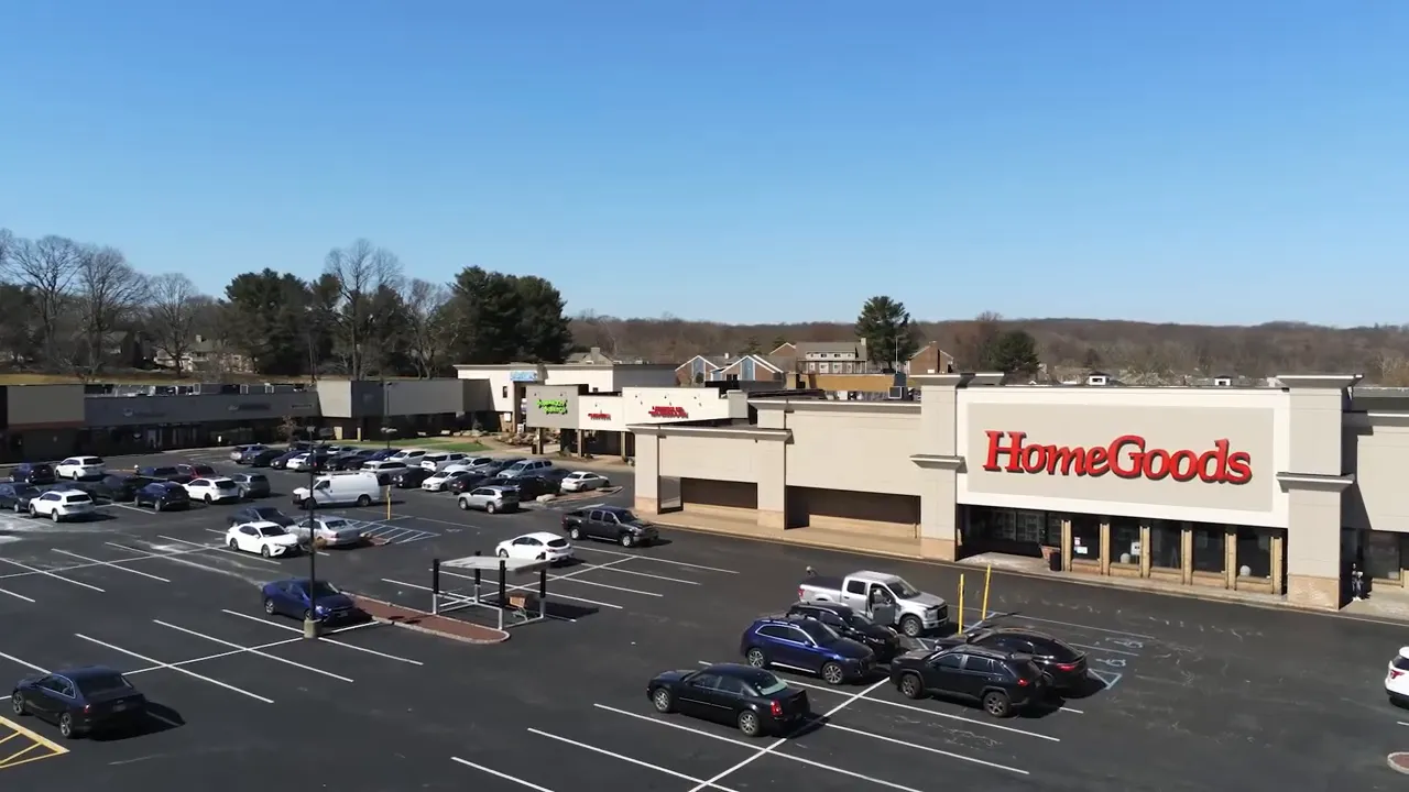Aerial view of Lowes storefront and large shopping center parking lot