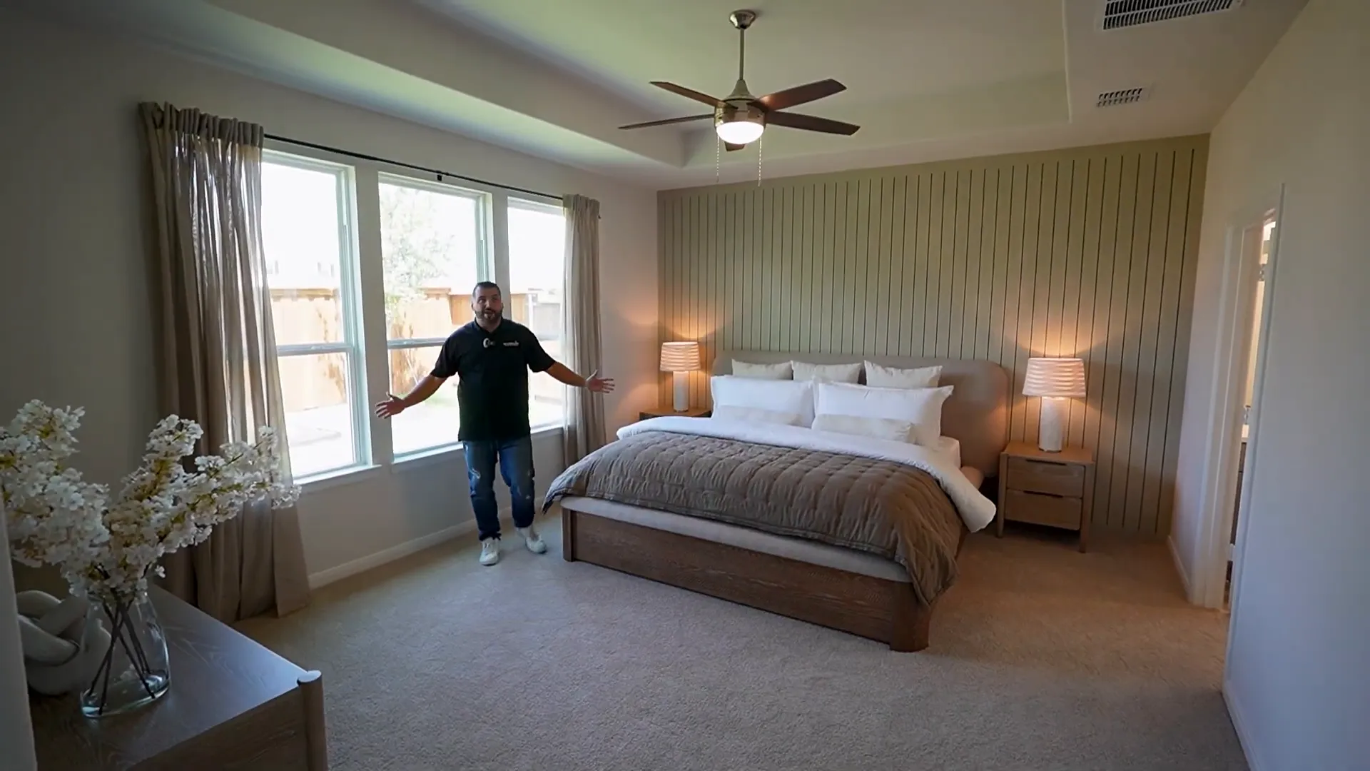 Massive primary suite with tray ceiling and three windows