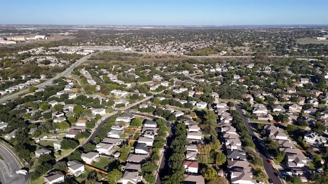 Stylized map showing Austin and nearby suburbs (Pflugerville, Round Rock, Hutto, Manor, Georgetown) with labels and county boundaries