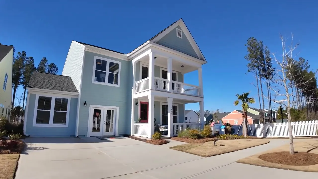 White and blue Jasper model home with double front porches