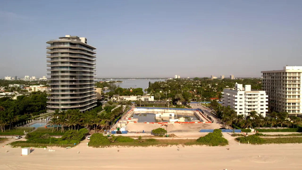 Presenter in studio with Broward County market snapshot inset, the $800 Million single‑family dollar volume circled to emphasize the figure.