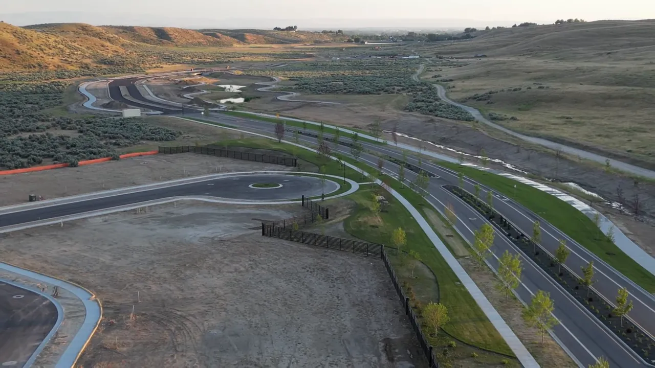 Built-in desk and countertop with quartz surface, overhead cabinets and a small stool — a versatile home office or drop zone