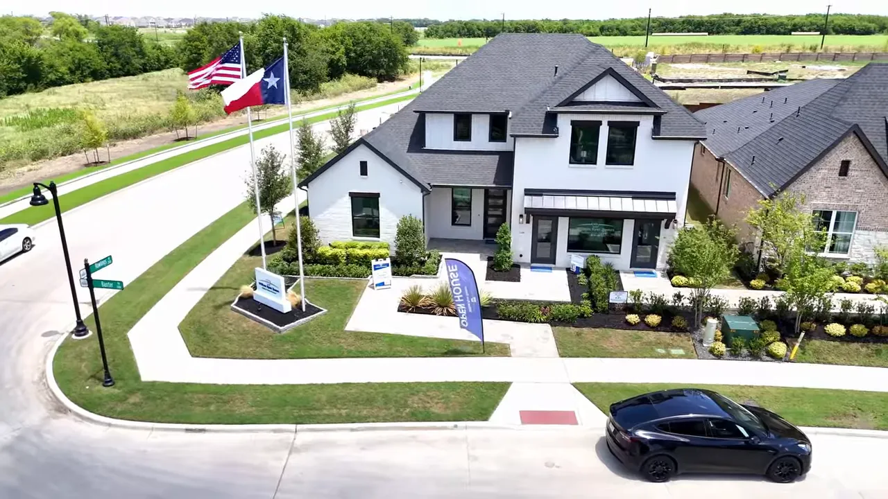 Living area with vaulted ceiling and painted brick fireplace