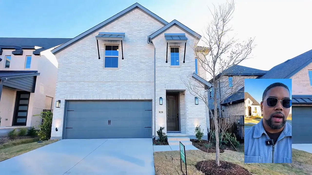 Two story white brick home with two car garage
