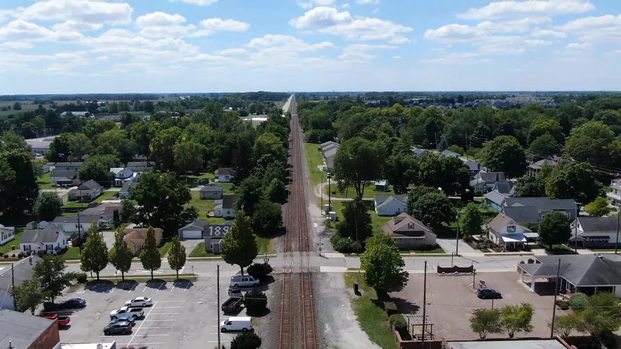 Aerial view of a Meijer grocery store and its parking lot near Fortville, showing a big-box shopping option close by.
