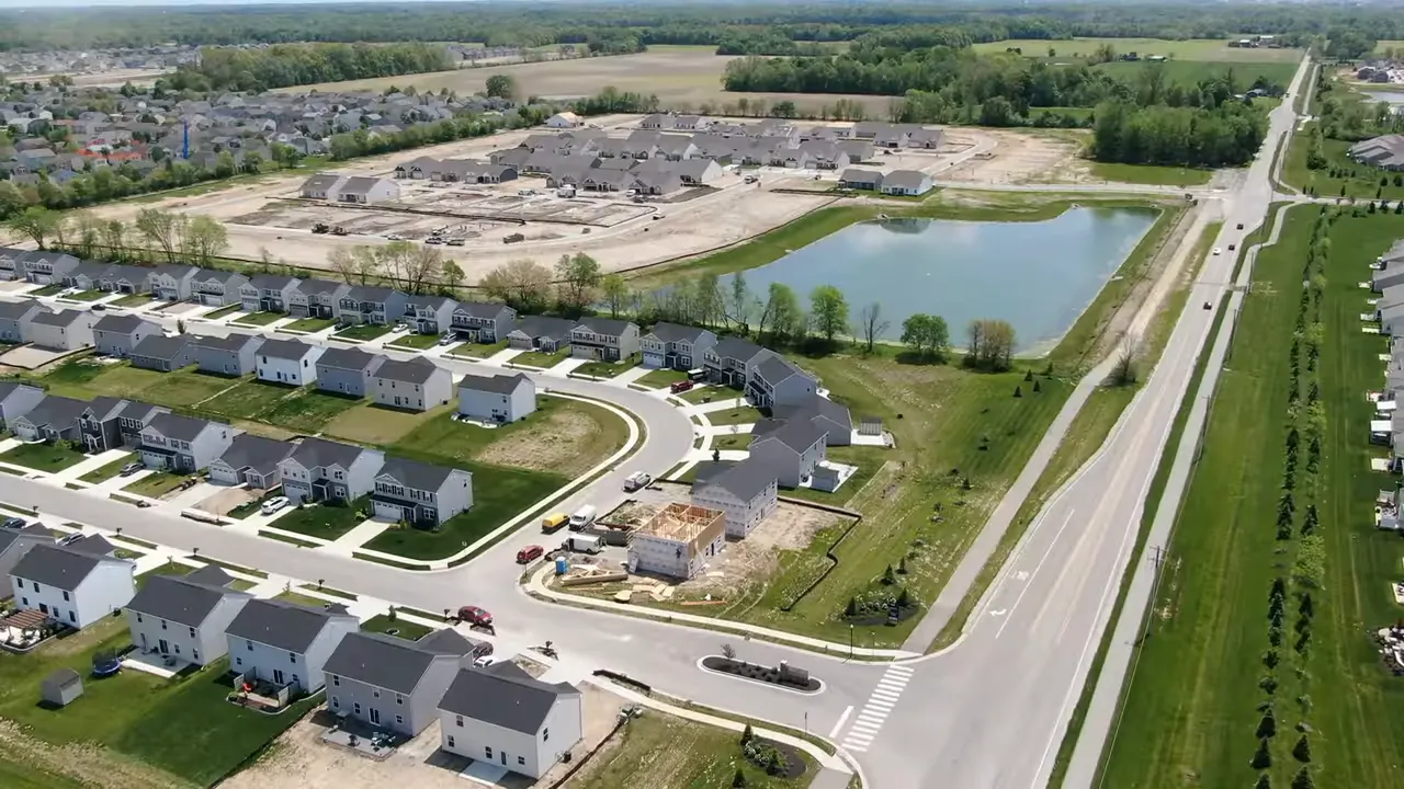 Aerial view of a school campus with parking lot, baseball field and athletic facilities near Fortville