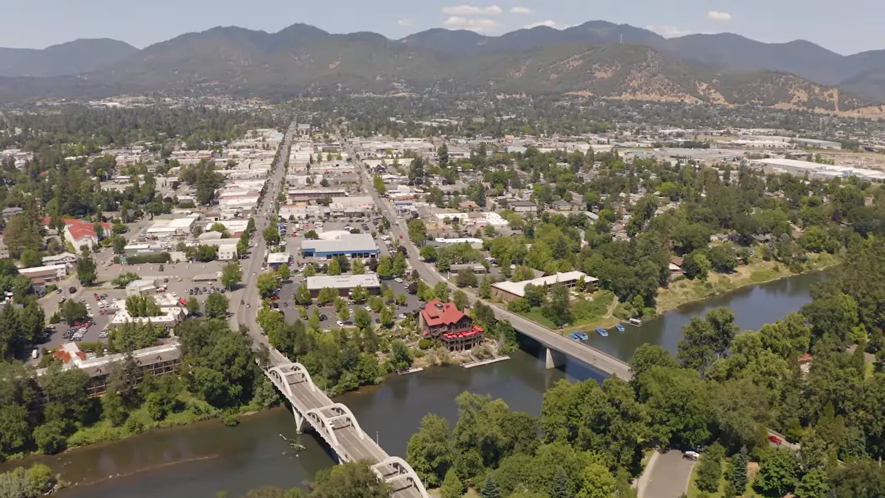 Aerial view of Grants Pass with the Rogue River and bridges