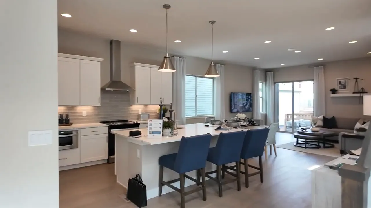 Residence 2 model home kitchen with open concept dining and living area