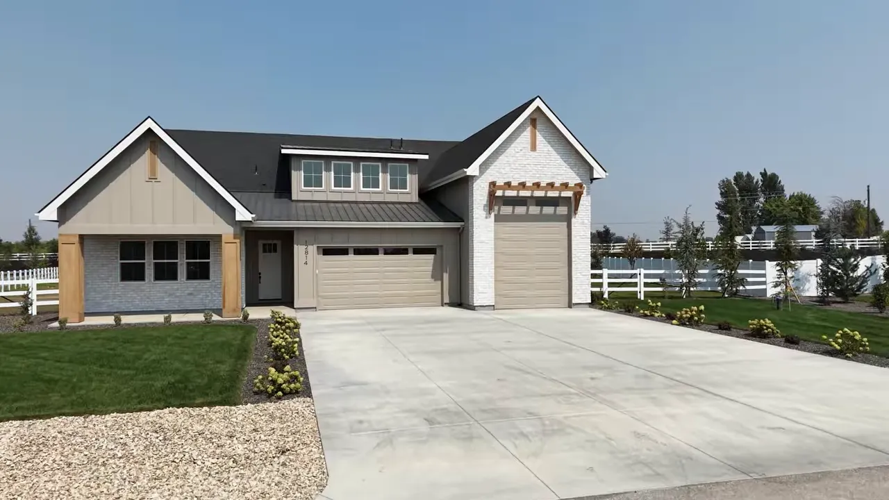 Front exterior with wide driveway standard garage and tall RV garage door