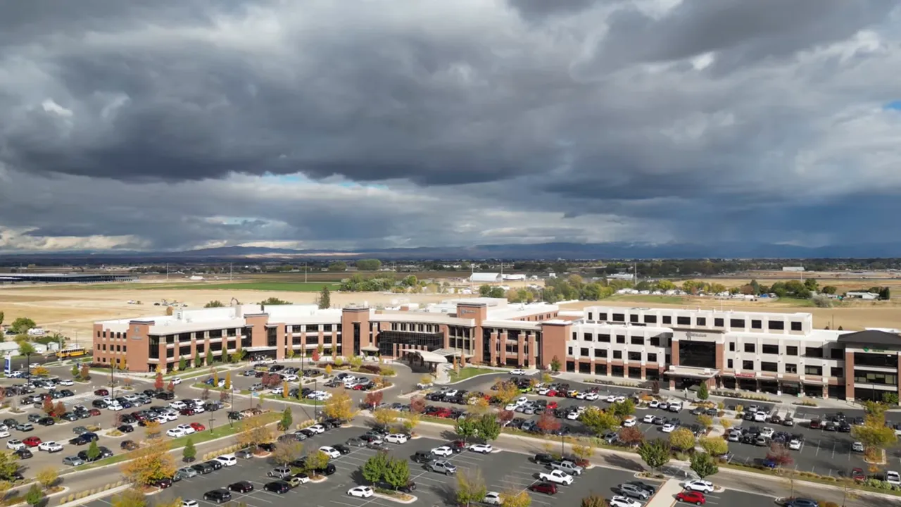 Clean downtown street with flower baskets and lamp posts