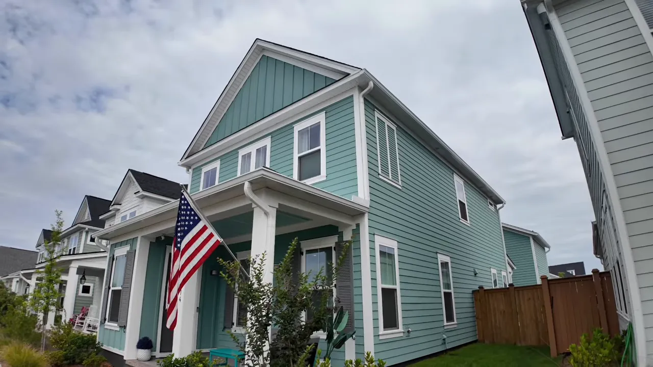 Front porch with epoxy floor coating, chairs, and teal bench