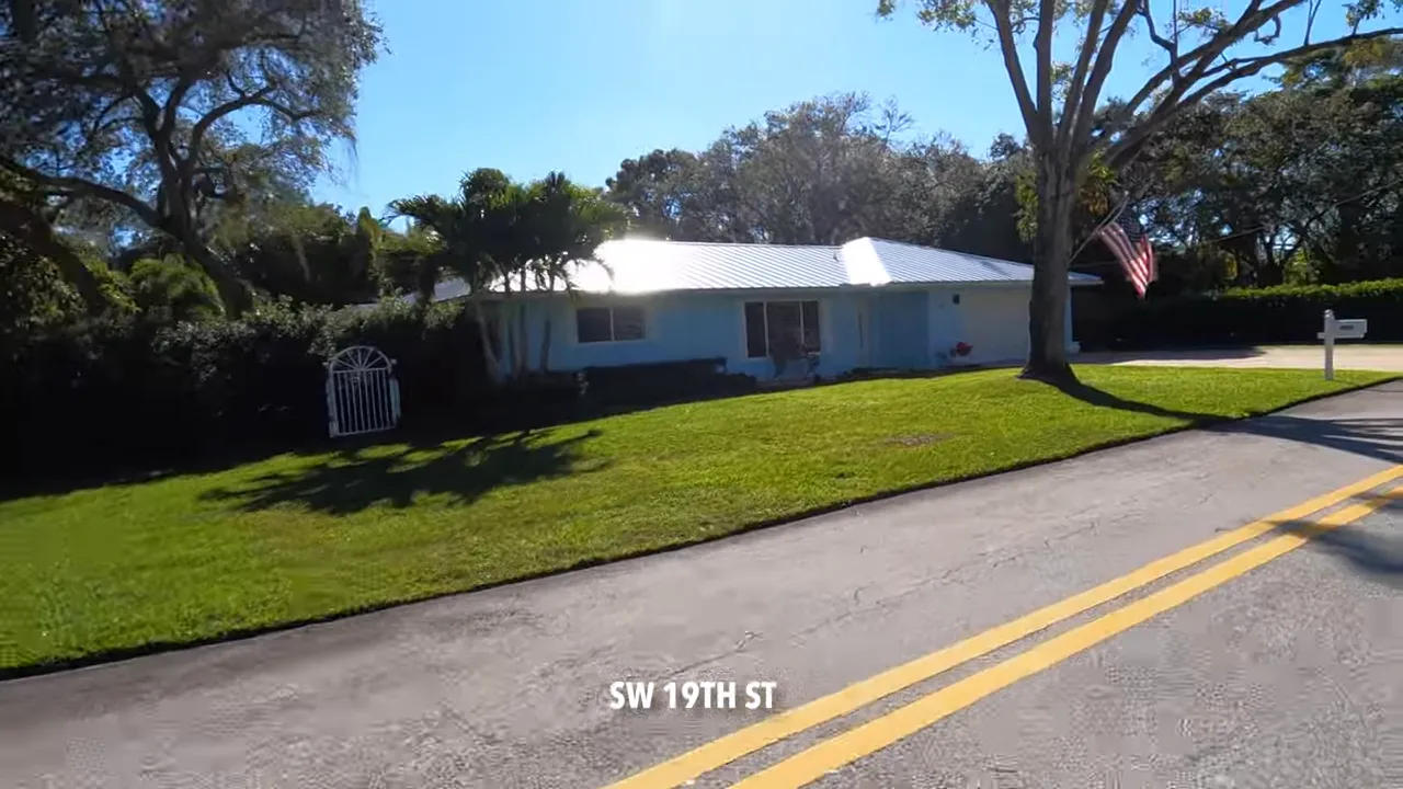 Palm Beach Farms neighborhood street with palm trees and landscaping in East Boca Raton