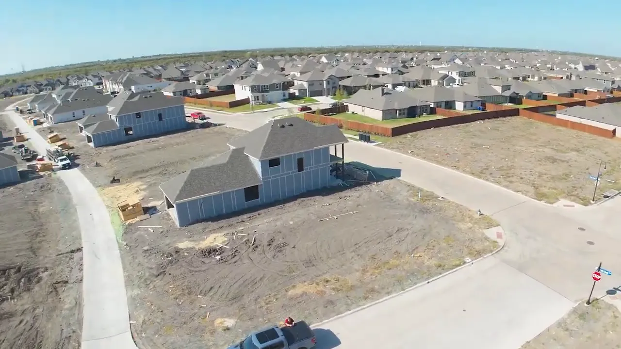 Model bathroom showing freestanding tub with tray and a glass-enclosed shower with patterned tile and shutters