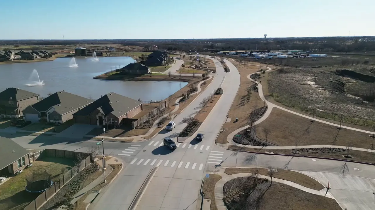 Aerial road and neighborhood view with graphic reading residential communities