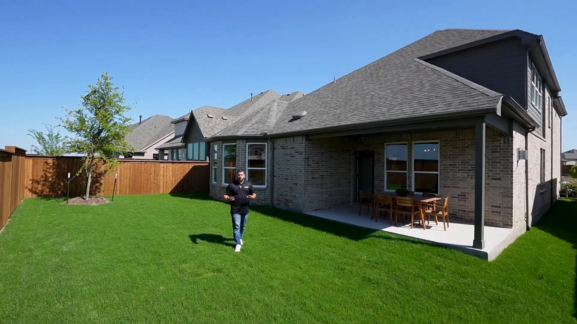 Aerial drone view of spacious backyard with pool potential