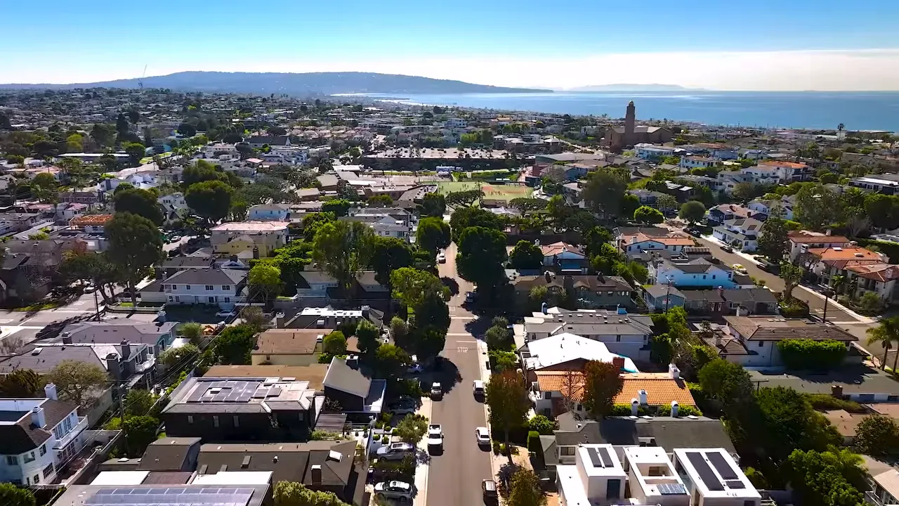 Aerial view of Long Beach with text stating homes from two million to six million have steady prices