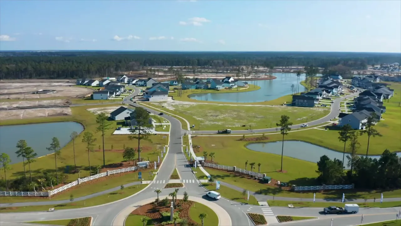 Cane Bay YMCA building with soccer fields and tennis courts in the amenity complex