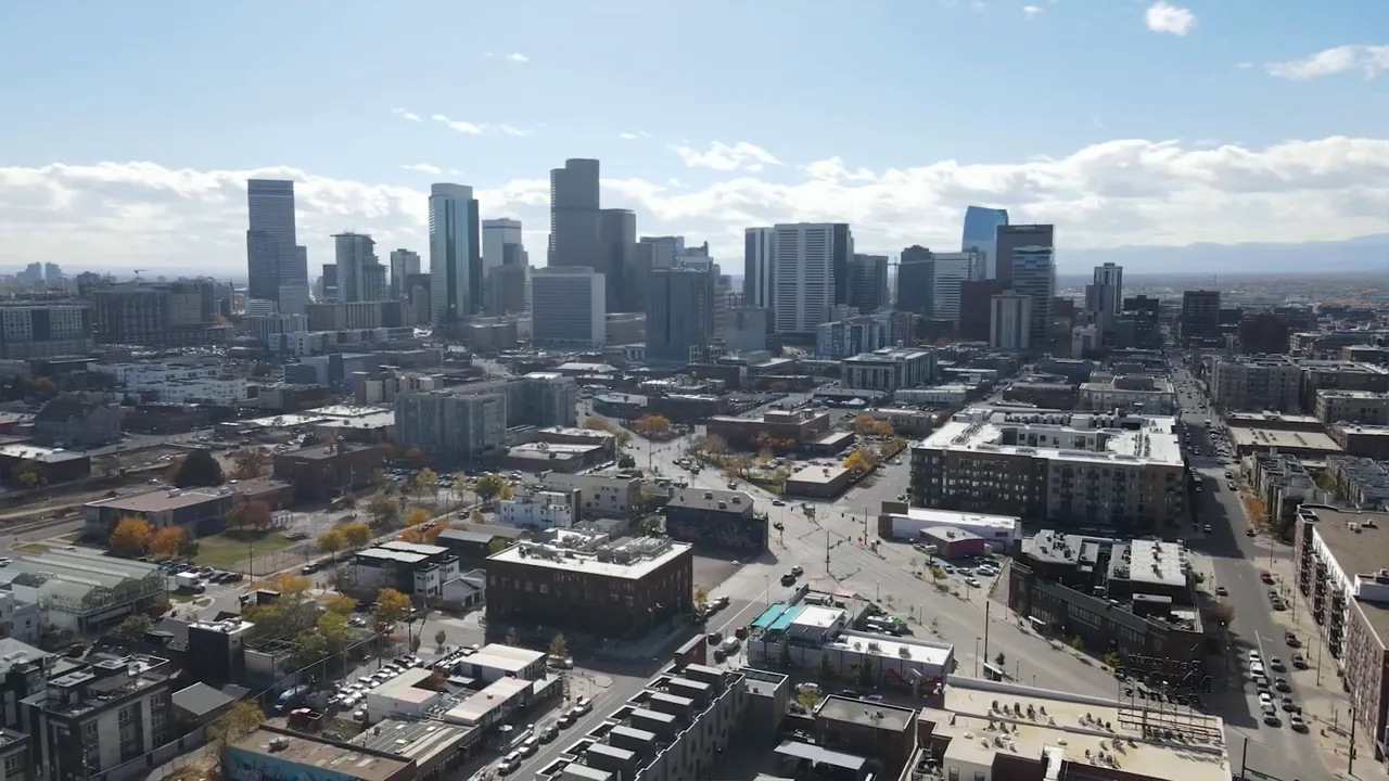 Aerial neighborhood view with text explaining migration losses and slight population growth