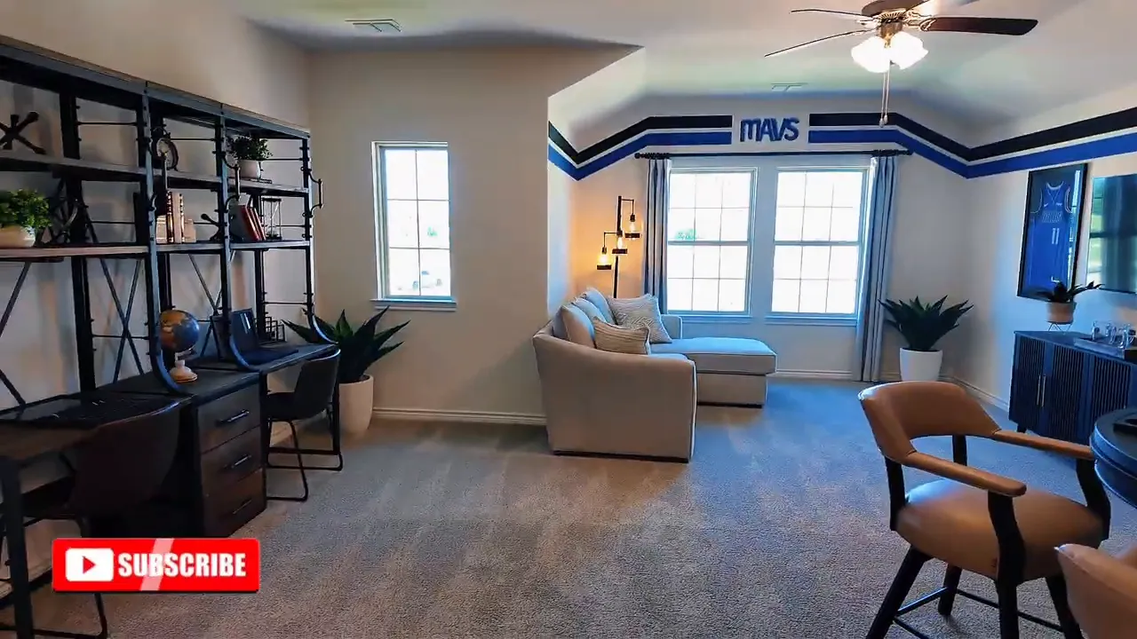 Upstairs game room with open seating area and built-in storage