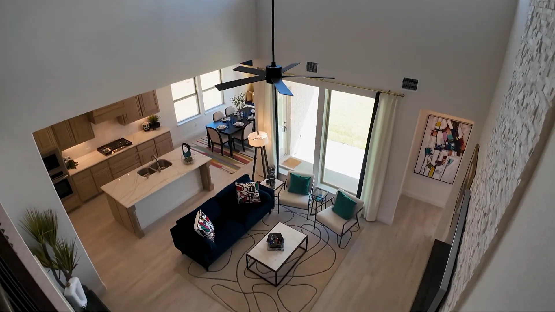 Two-story ceiling with stacked stone fireplace