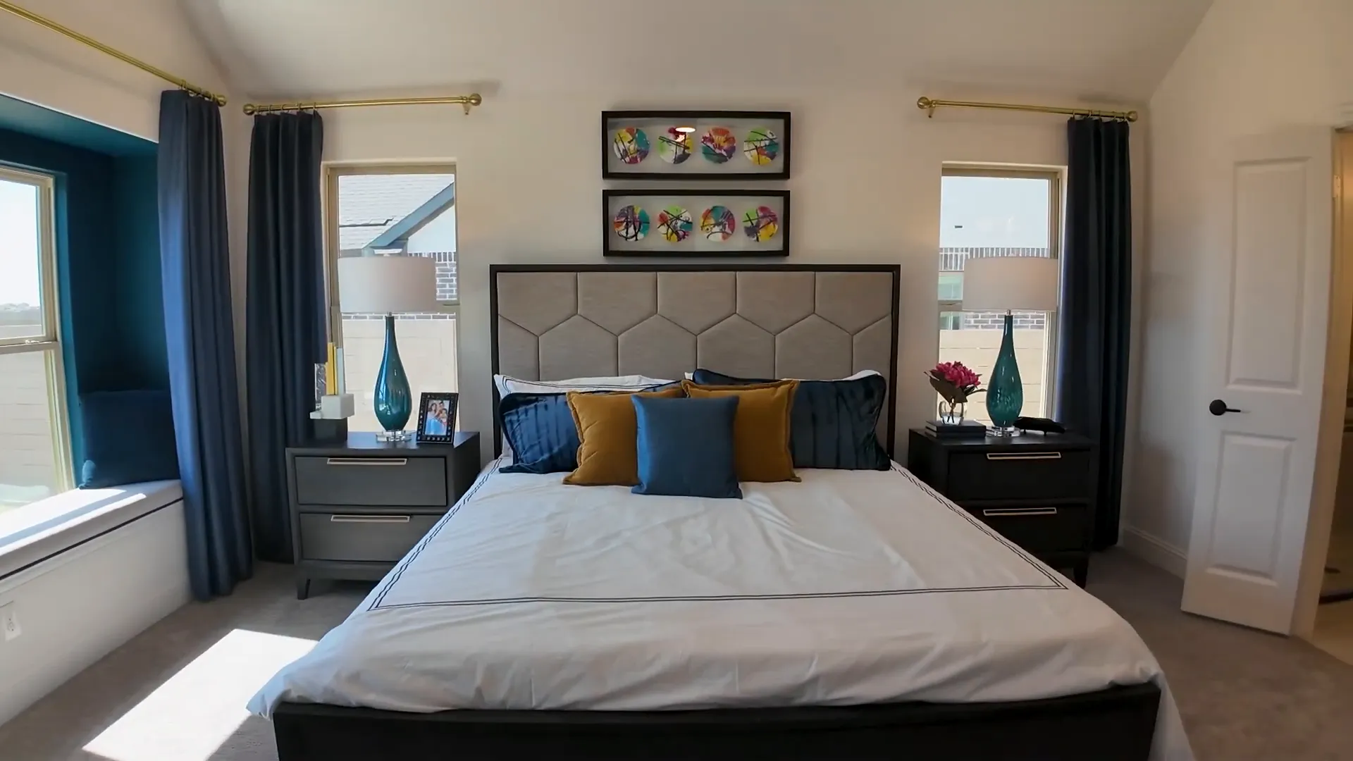 Primary suite with cathedral ceilings and window seat