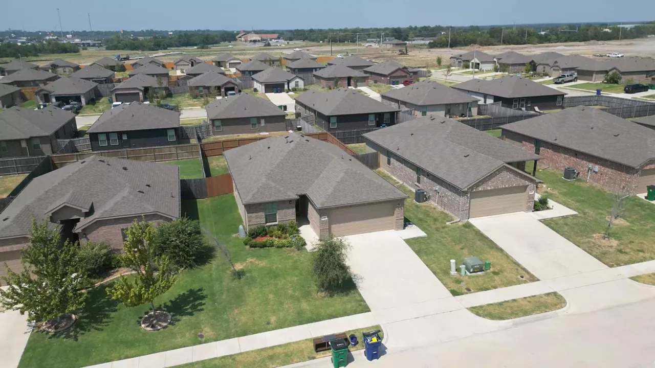 Neighborhood model home with promotional signs