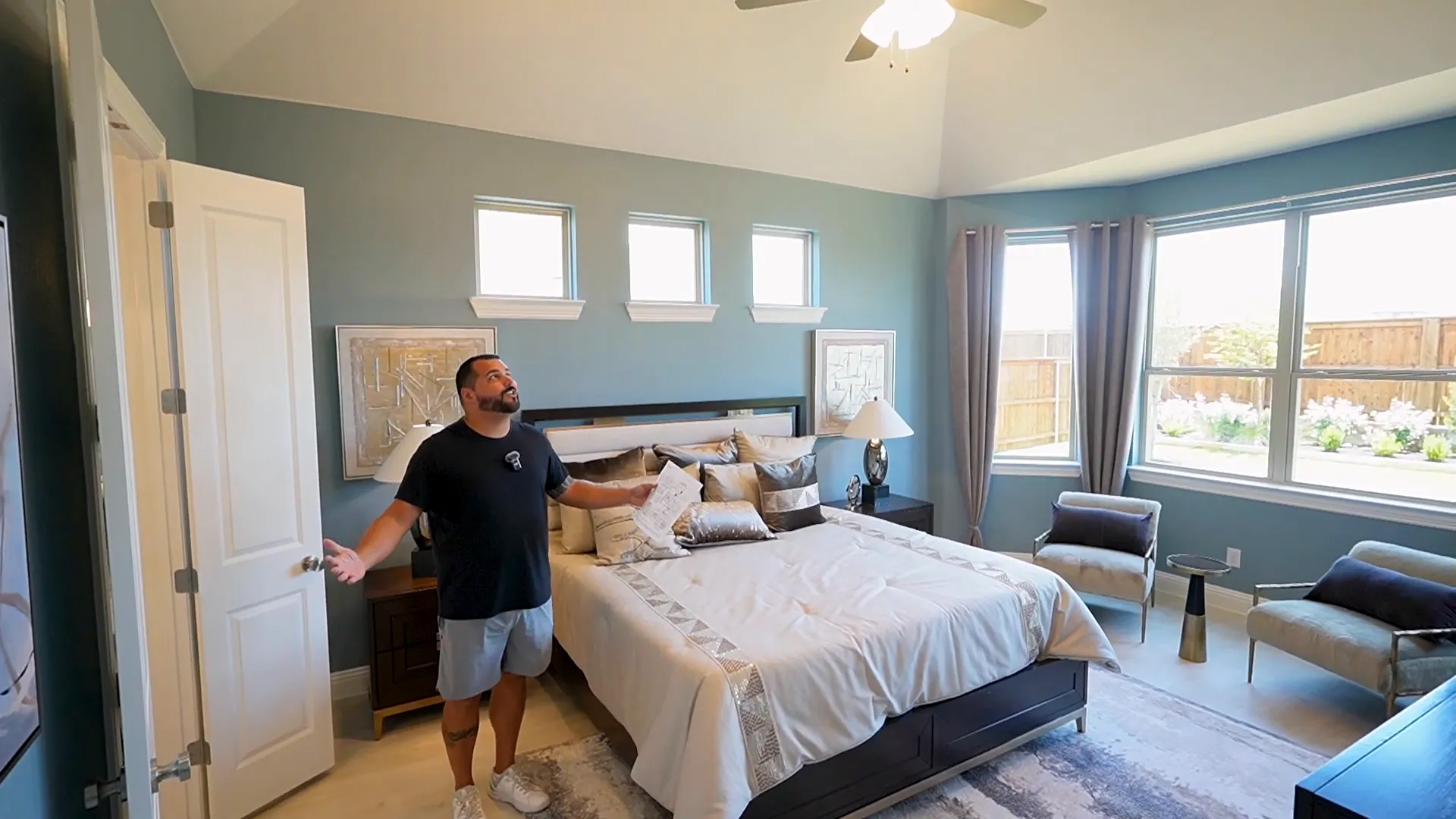 Primary suite with vaulted ceilings and bay window seating area