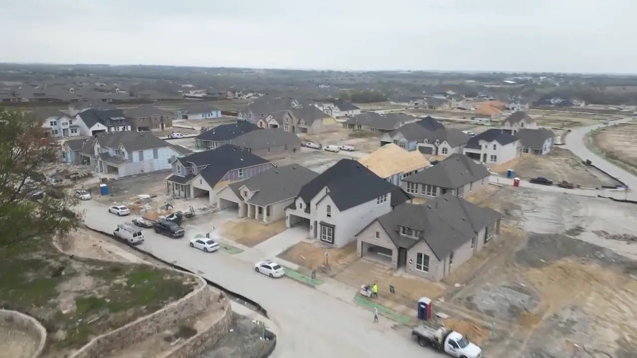 Aerial view of Monterra streets homes under construction and landscaped entrance