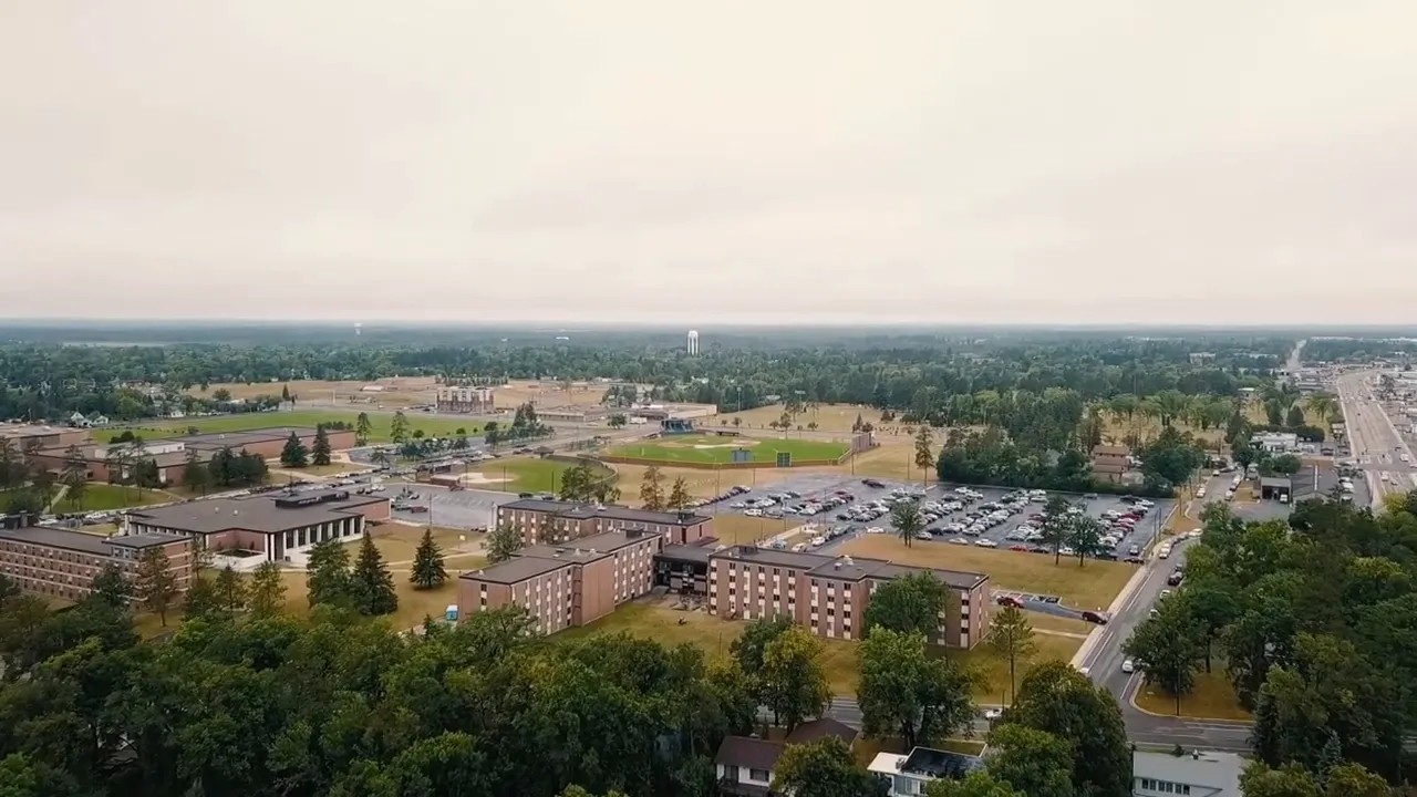 Two hosts discussing new construction home buying tips on a studio couch