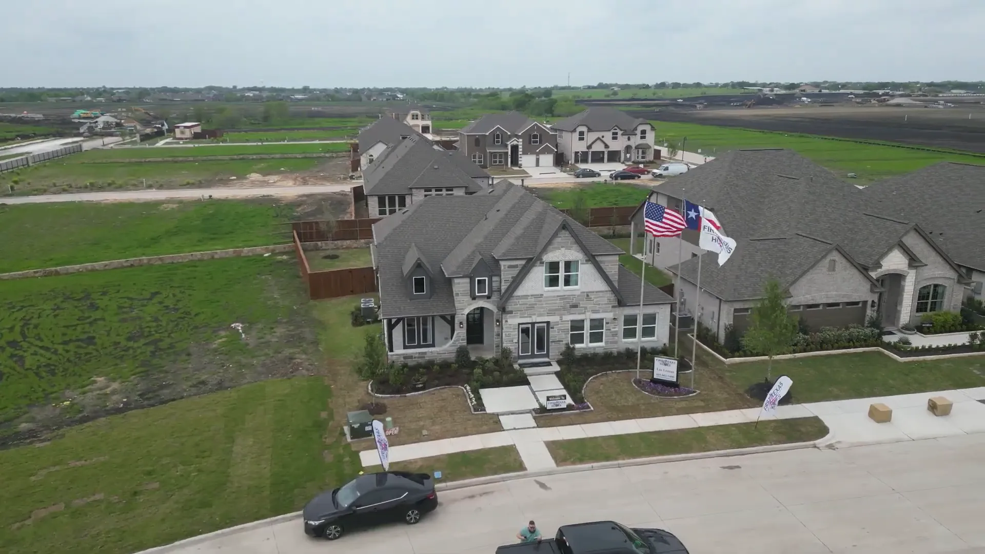 Stone and brick First Texas model home exterior