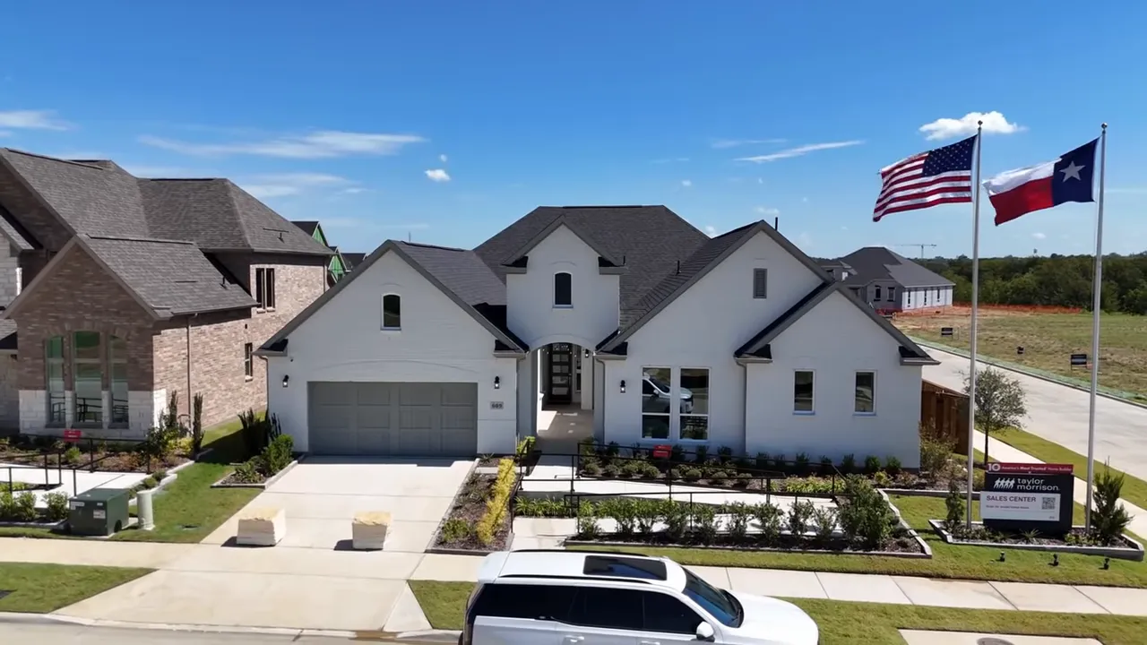 Front entry foyer with tall ceilings and sightlines to main living area